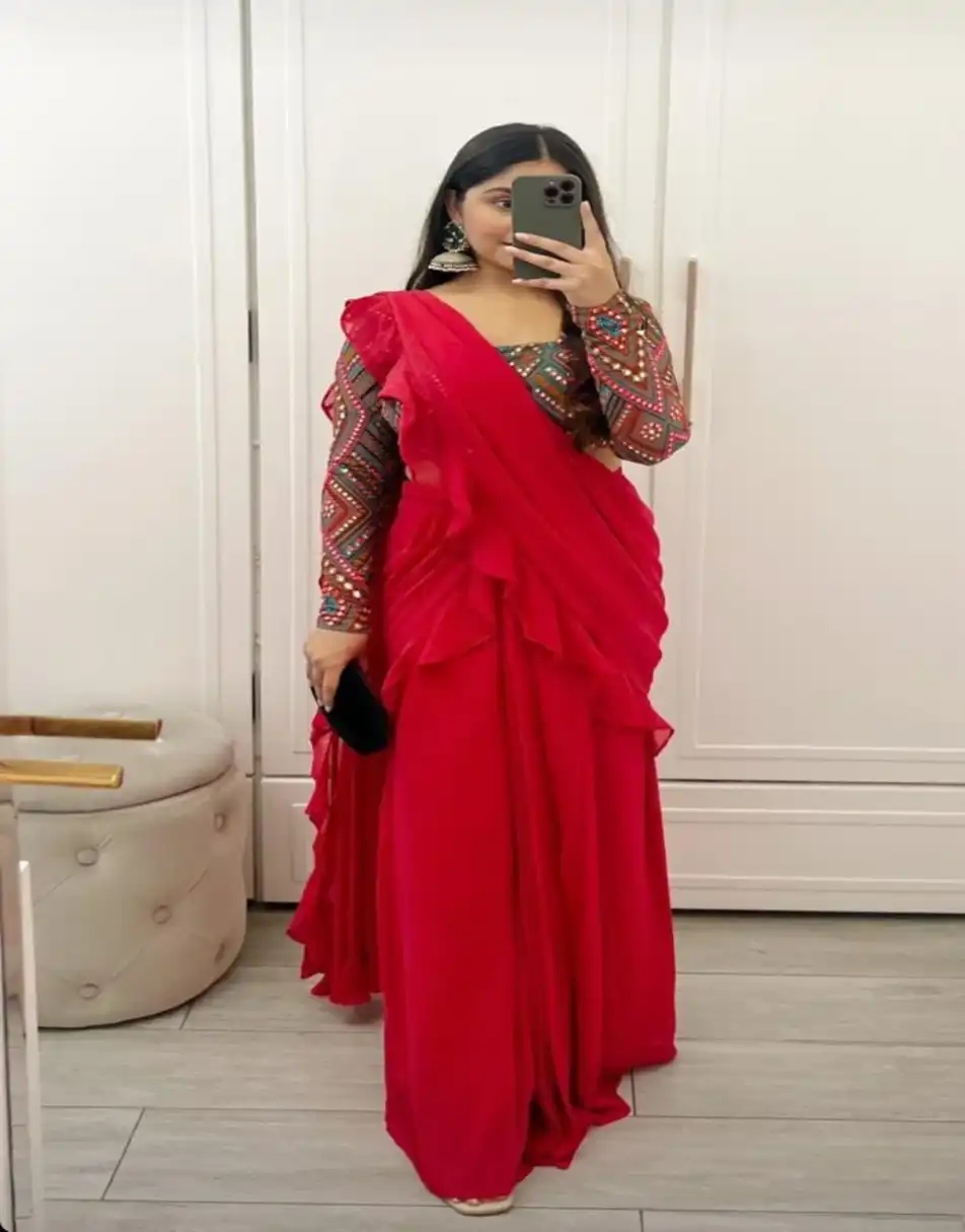 Embroidered blouse with pink ruffle saree