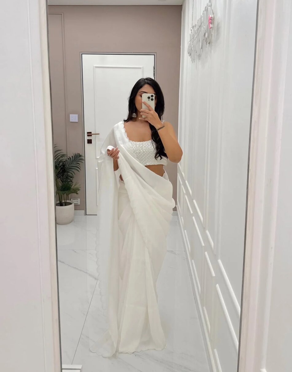 Ivory saree with embellished blouse