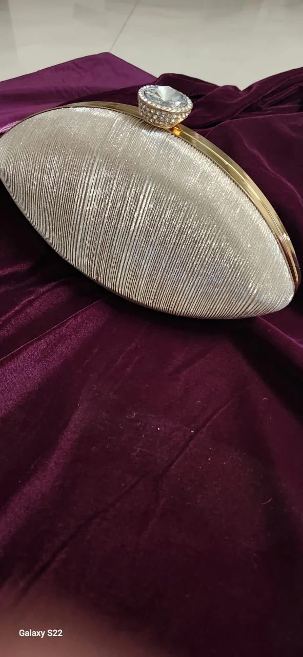 Oval shimmer box clutch